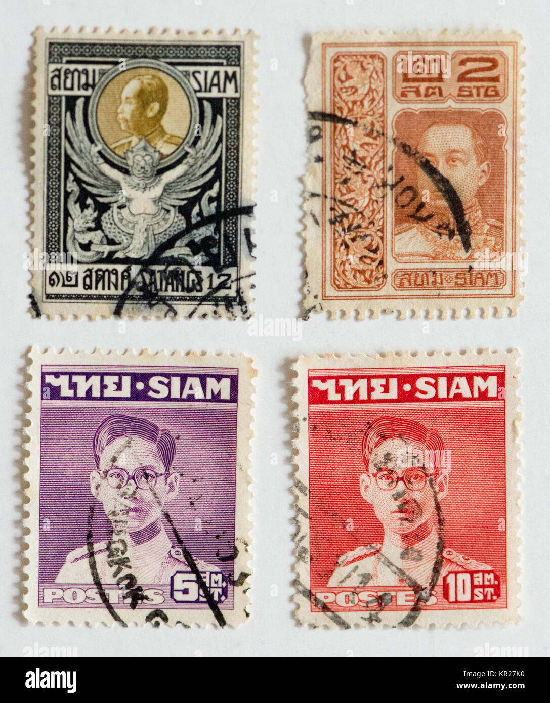Vier Briefmarken aus Siam oder Thailand. Stockfoto