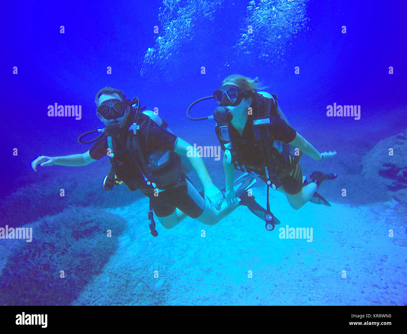 Schnorchler und Taucher Stockfoto