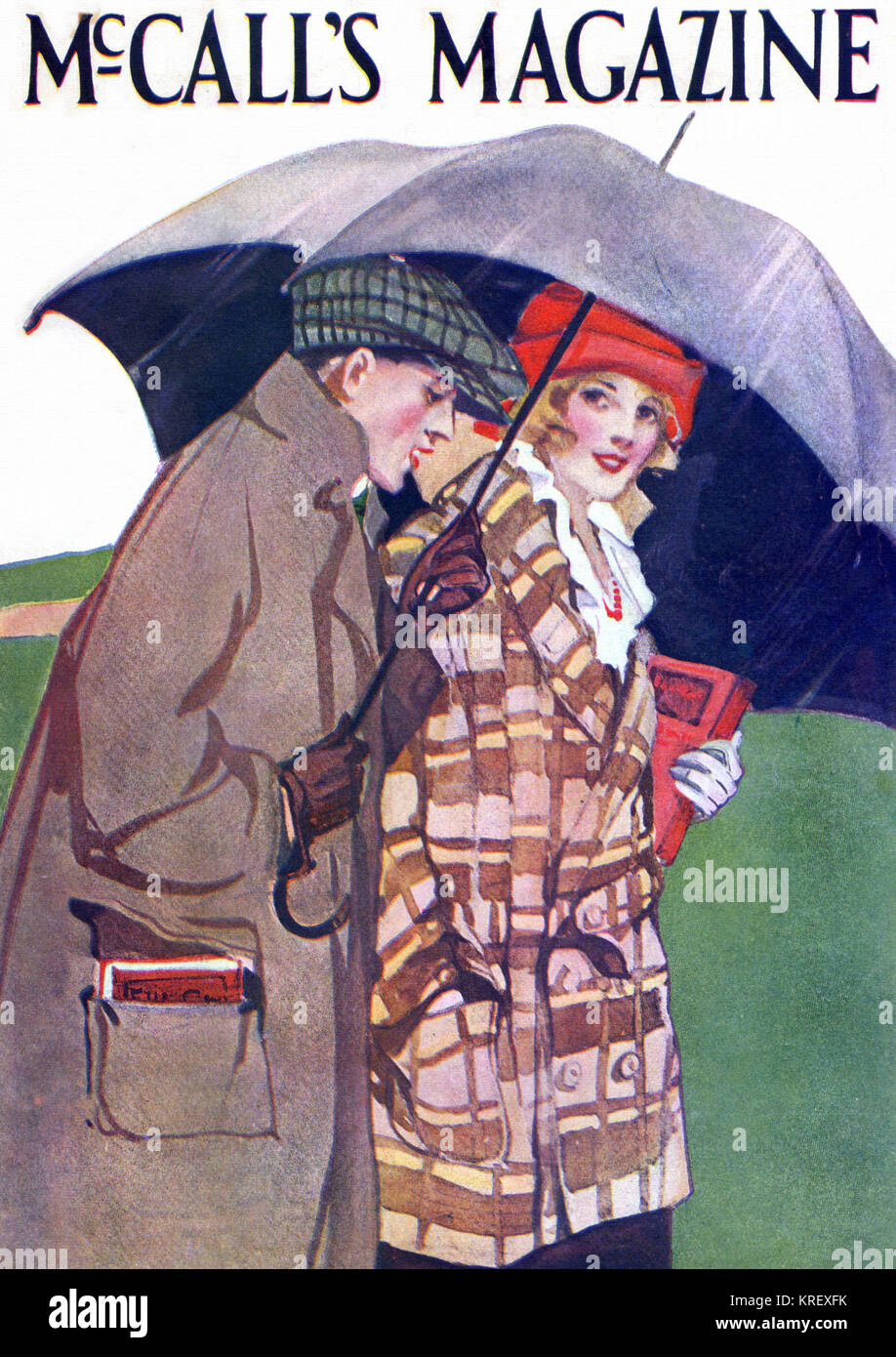 Junge Liebhaber unter einen Schirm Stockfoto