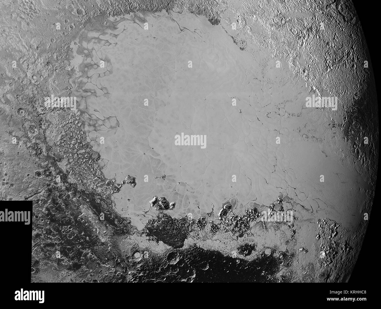 Mosaik der hochauflösende Bilder von Pluto, zurück von der NASA-Raumsonde New Horizons ab Sept. 5 bis 7, 2015. Das Bild wird durch die informell - genannt, eisigen plain Sputnik Planum, die glatte, helle Region in der Mitte dominiert. Dieses Image verfügt auch über eine enorme Vielfalt von anderen Landschaften in der Umgebung Sputnik. Die kleinsten sichtbaren Merkmale sind 0,5 Meilen (0,8 Kilometer) in der Größe, und das Mosaik deckt eine Region rund 1000 Meilen (1600 Kilometer). Das Bild wurde als neue Horizonte, flog hinter Pluto am 14. Juli 2015, über eine Distanz von 50.000 Meilen (80.000 Kilometer). Credits: NASA Stockfoto