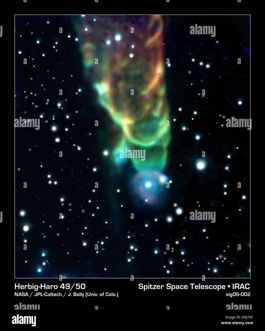 Diese "Tornado," erklärt Herbig-Haro 49/50, wird von einer kosmischen jet Verpackung eine geballte Ladung wie Pflüge durch Wolken aus interstellarem Gas und Staub geformt. Der Tornado - wie Feature ist wirklich ein Schock vorne auf einem Jet Material fließt nach unten durch den Bereich der Ansicht erzeugt. Ein noch-forming Stern befindet sich am oberen Rand des Bildes dieser Abfluss generiert. Die Jet-Slams in benachbarte Staubwolken mit einer Geschwindigkeit von mehr als 100 Meilen pro Sekunde, Heizung, um den Staub zu glühen und wodurch es zu glühen mit Infrarotlicht nachweisbar durch Spitzer. Die dreieckige Form ergibt sich aus der Crea Stockfoto