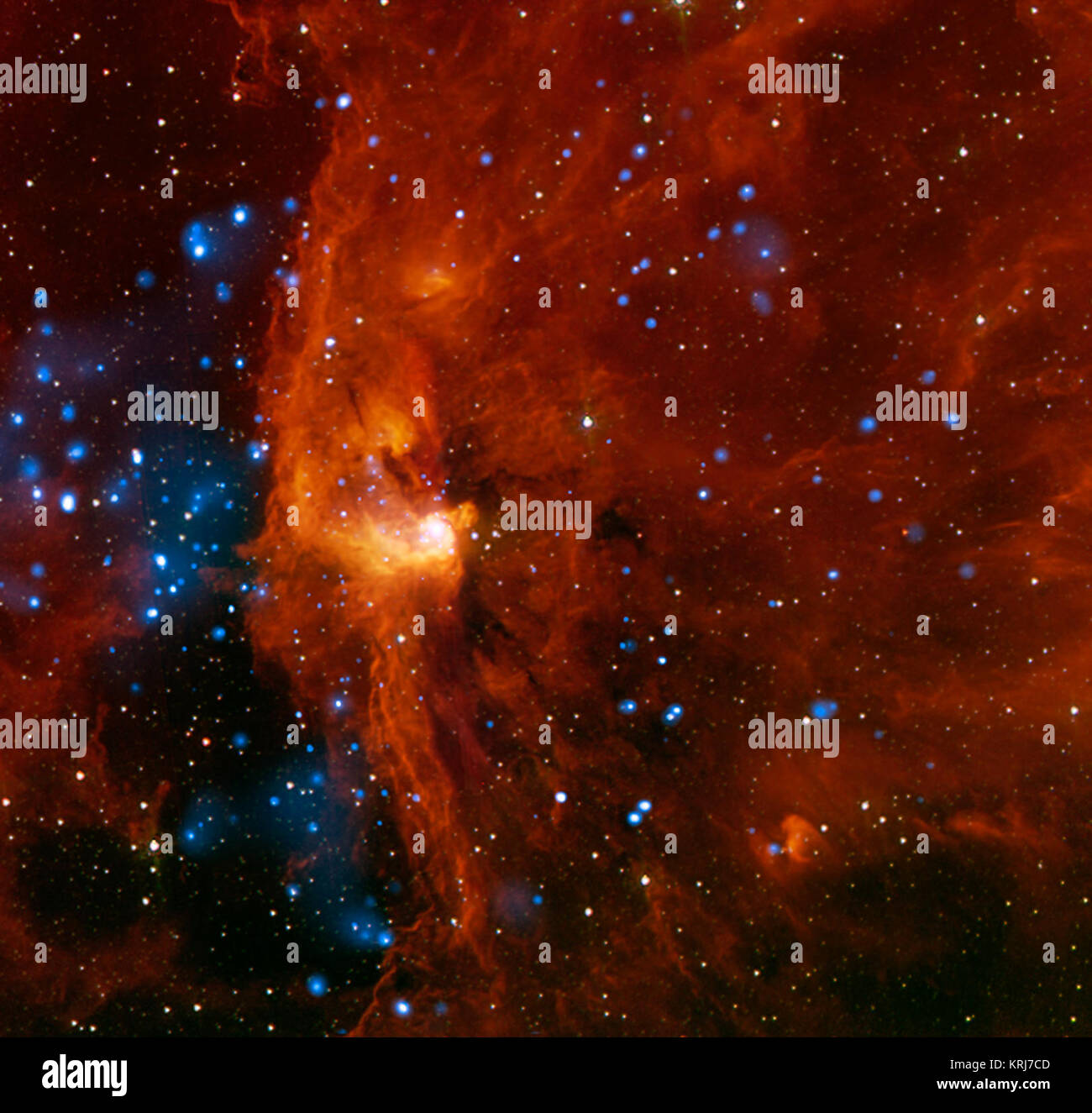 RCW 108 ist eine Region, in der Sterne aktiv, die in der Milchstraße sind rund 4.000 Lichtjahre von der Erde entfernt. Das ist eine komplizierte Region mit jungen Sternhaufen, darunter eines, das tief in eine Wolke von molekularem Wasserstoff eingebettet ist. Durch die Verwendung von Daten aus verschiedenen Teleskopen können Astronomen festgestellt, dass Star Geburt in dieser Region, die durch die Wirkung von in der Nähe, massive junge Sterne ausgelöst wird. Dieses Bild ist ein Verbund von X-ray Daten von der NASA Chandra X-ray Observatory (blau) und Ir-Emission von NASA's Spitzer Space Telescope (rot und orange). Mehr als 400 X-ra Stockfoto