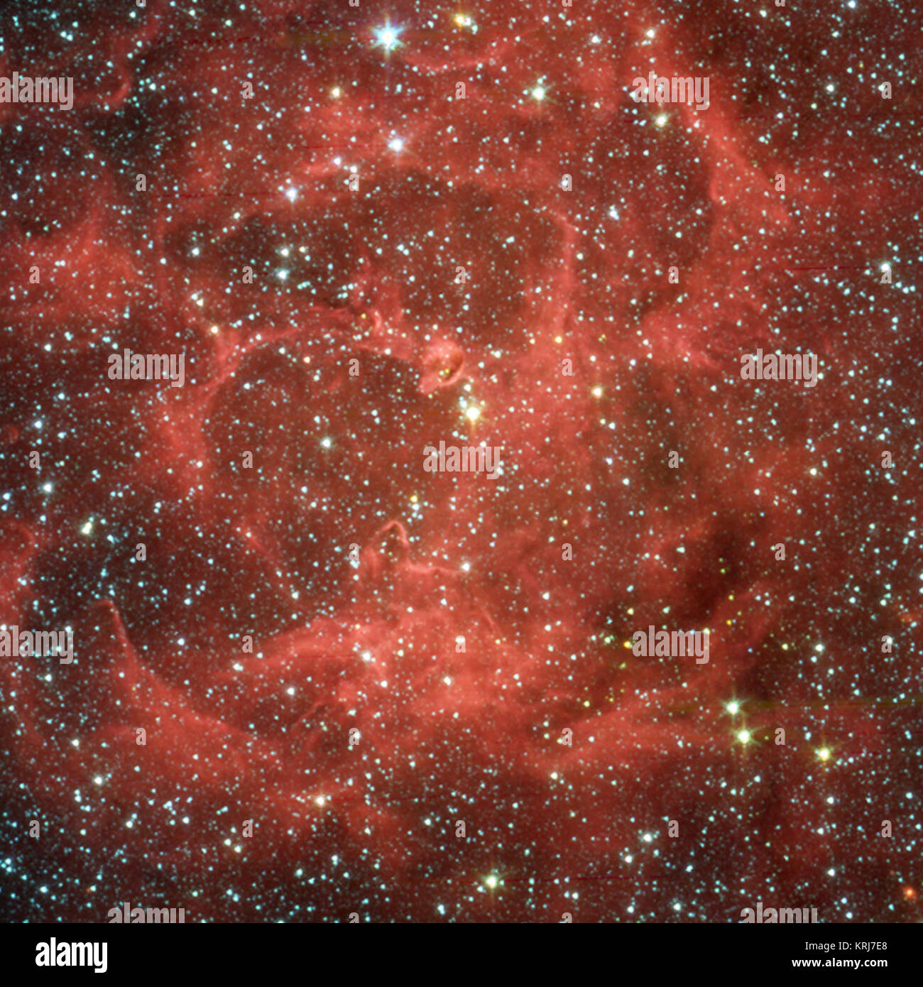 Dieses Bild zeigt eine Nahaufnahme infrarot Ansicht von NASA's Spitzer Space Telescope der glühenden Trifid Nebula, eine riesige Sterne bilden Wolke aus Gas und Staub entfernt 5.400 Lichtjahre entfernt im Sternbild Schütze. Die Daten der gleichen Region aus dem Institut für Radioastronomie millimeter Teleskop in Spanien vier dichten Knoten, oder Kerne offenbart, der Staub, die "Inkubatoren" für EMBRYONALE Sterne. Die Astronomen dachten diese Kerne noch nicht für Sterne reif waren, bis Spitzer die Wärme des schnell wachsenden massive Embryonen im Inneren versteckt entdeckt. Diese Embryonen in der falschen Farbe Spitzer aufgedeckt werden pictu Stockfoto