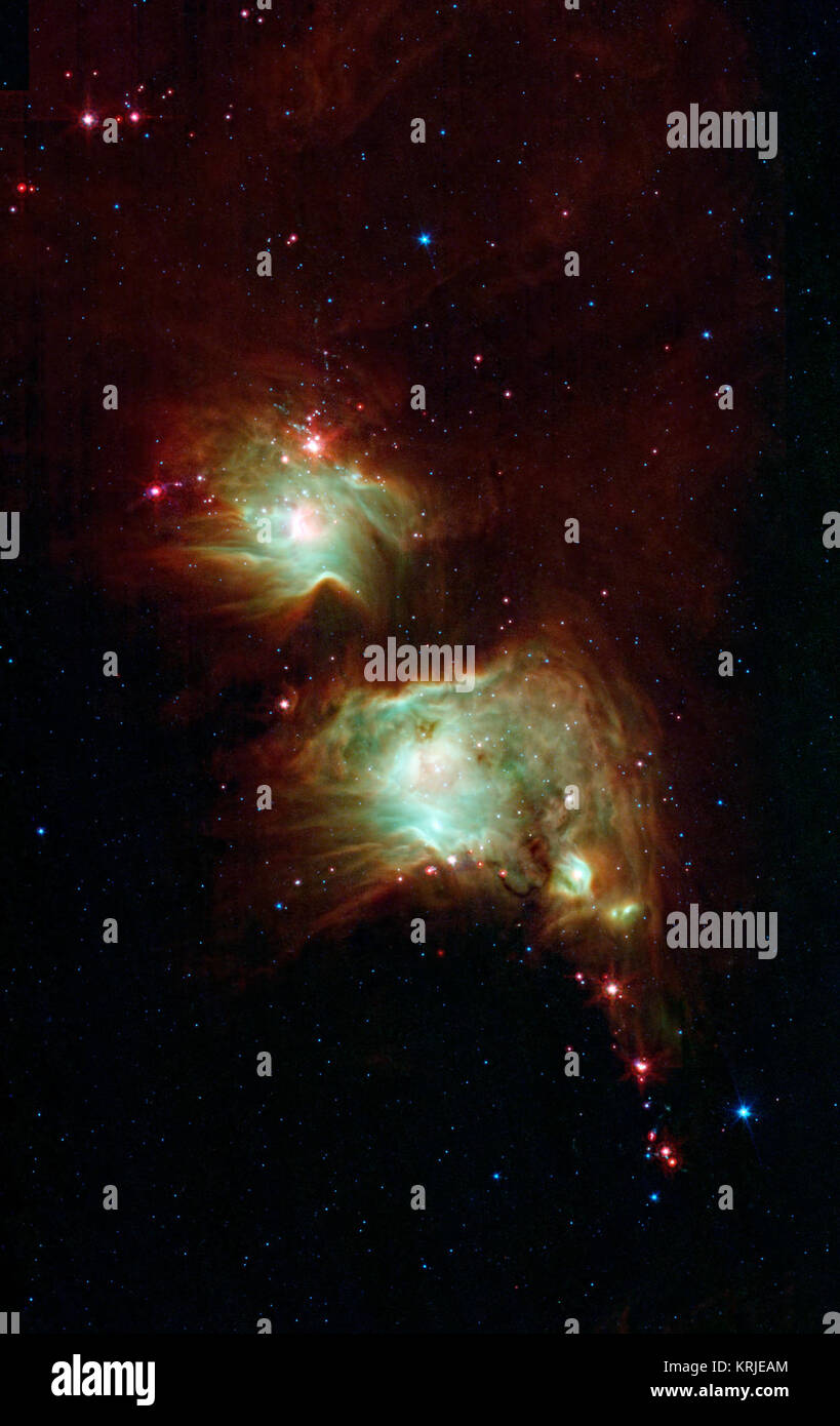 Wie eine Brille nur ein Rock Star tragen würde, dieser Nebel bringt in einem düsteren Region der Sternentstehung konzentrieren. Die NASA-Weltraumteleskop Spitzer entlarvt die Tiefen dieses staubigen Nebel mit seinen Infrarot Vision, die stellare Säuglinge, die hinter dunklen Wolken verloren gehen, wenn im sichtbaren Licht gesehen. Am Besten als Messier 78, die zwei Runden grünlich Nebel bekannt sind tatsächlich Hohlräume geschnitzt aus den umliegenden dunkle Staubwolken. Die erweiterte Staub ist meist dunkel, auch auf Spitzers Ansicht, aber die Kanten zeigen bis Mitte Wellenlänge Infrarotlicht als leuchtende rote umgibt, die hellen int Stockfoto