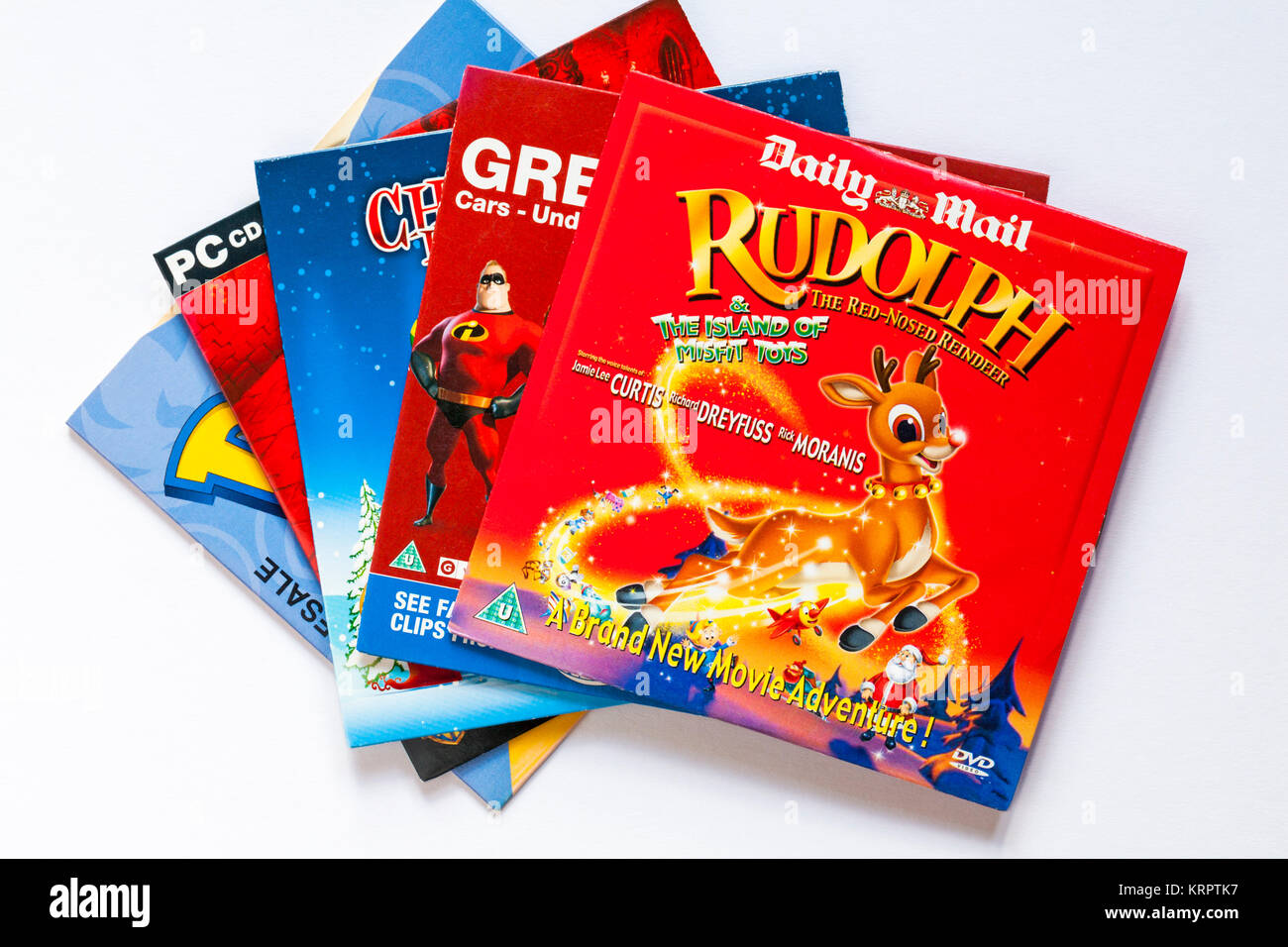 Die Auswahl der Kinder DVDs mit Rudolf, das Rentier mit der roten Nase & die Insel der Außenseiter Spielzeug DVD oben auf weißem Hintergrund Stockfoto