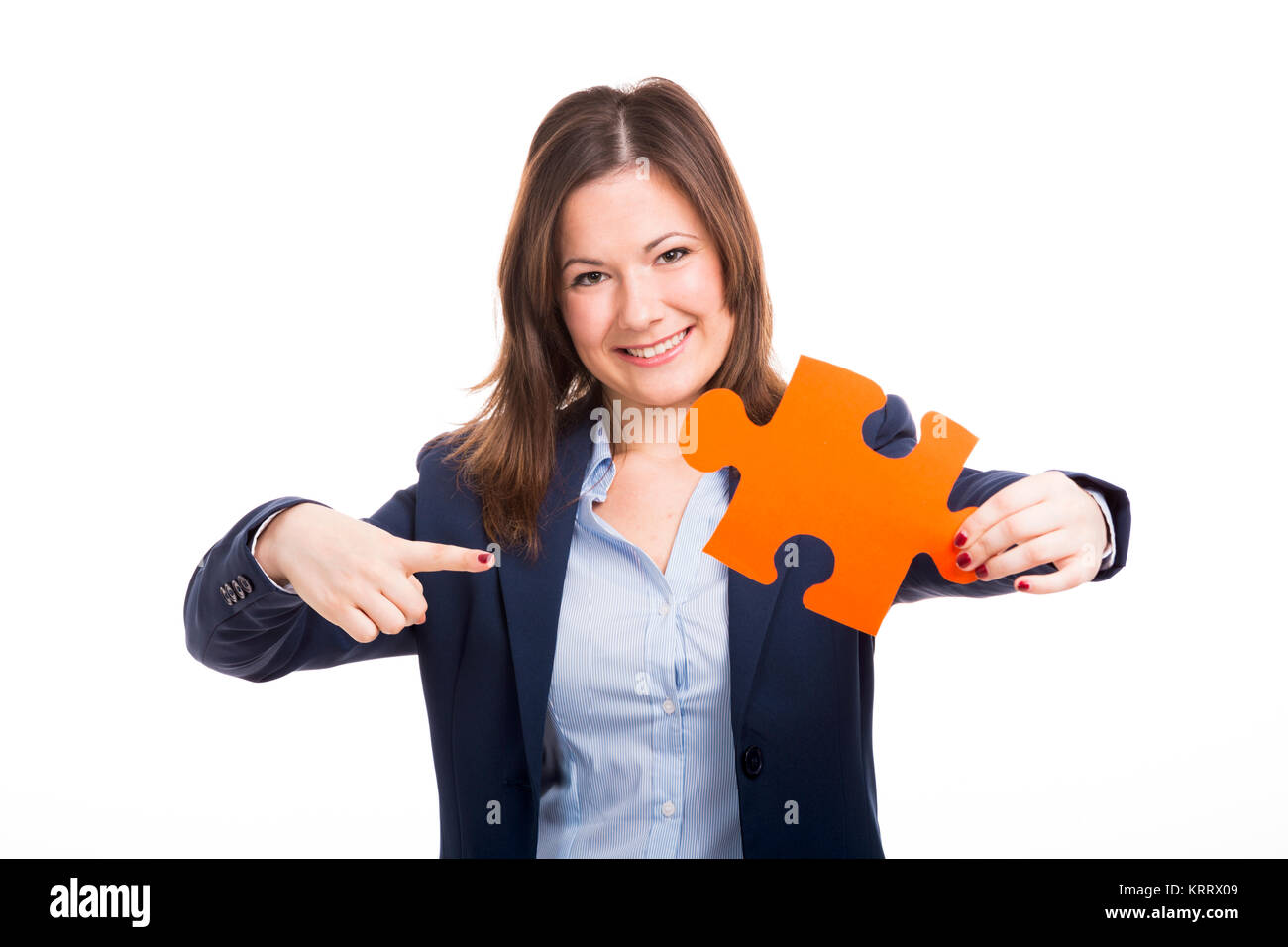Business woman holding ein Puzzleteil Stockfoto