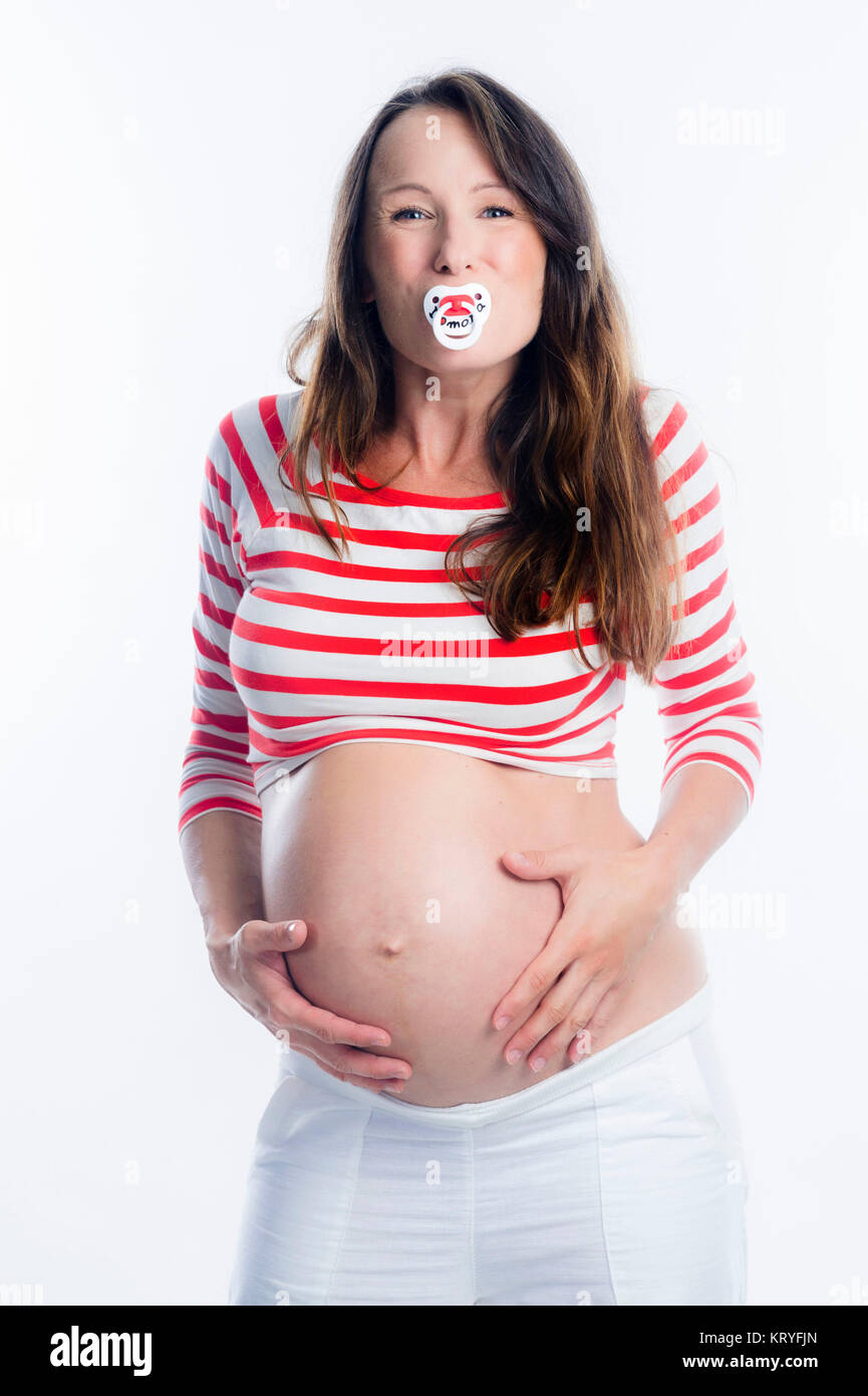 Schwangere Frau mit Schnuller im Mund-schwangere Frau mit Dummy Stockfoto