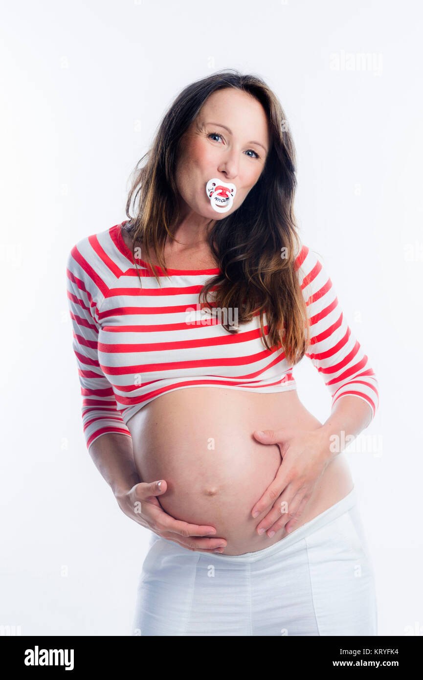Schwangere Frau mit Schnuller im Mund-schwangere Frau mit Dummy Stockfoto