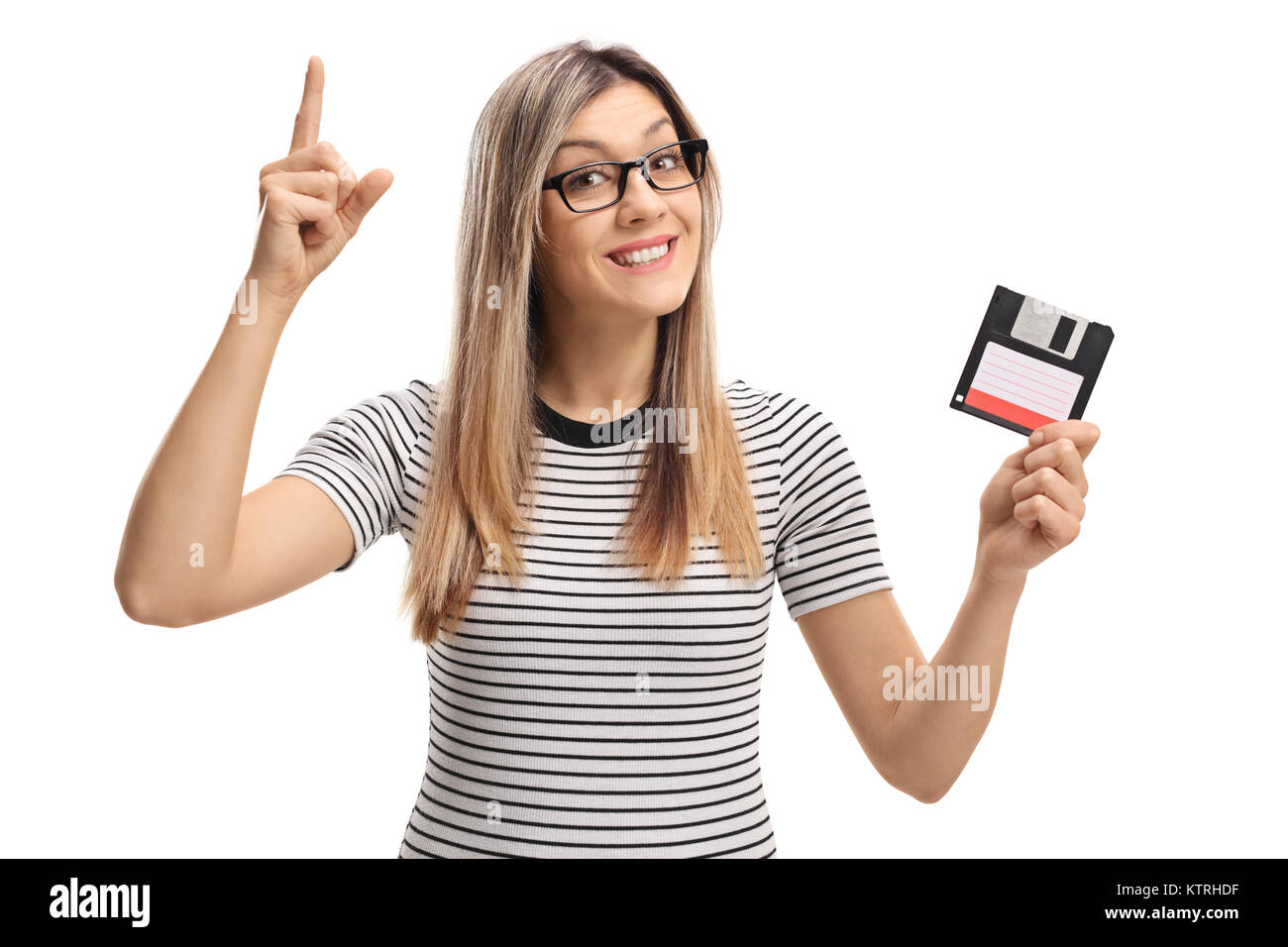 Junge Frau mit einer Diskette Zeigefinger bis auf weißem Hintergrund Stockfoto