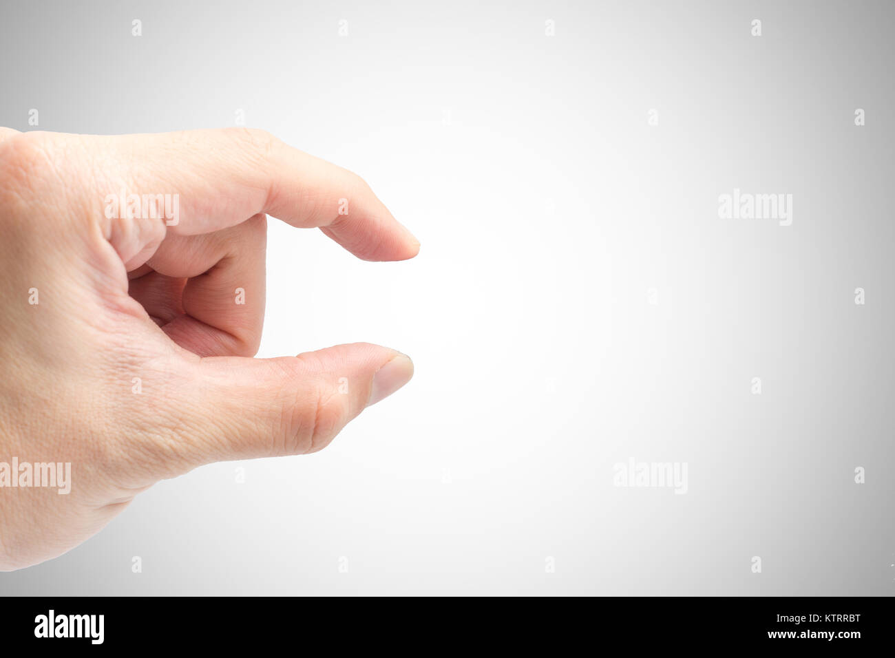 Männliche Hand Finger pick oder Körperhaltung Greifer closeup Schuß auf Weiß mit Freistellungspfad isoliert Stockfoto