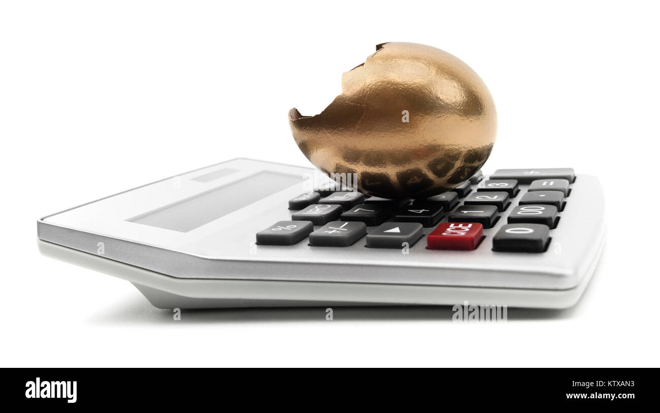 Geknackt goldene Ei auf einem Rechner. Stockfoto