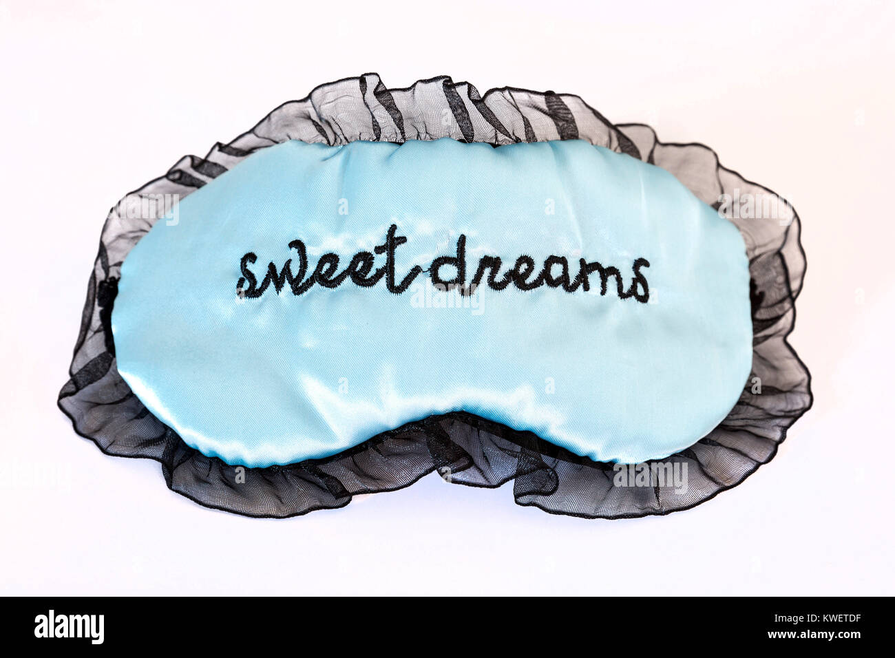 Schlafbrille auf einem weißen Hintergrund. Süße Träume. Studio gedreht. Stockfoto