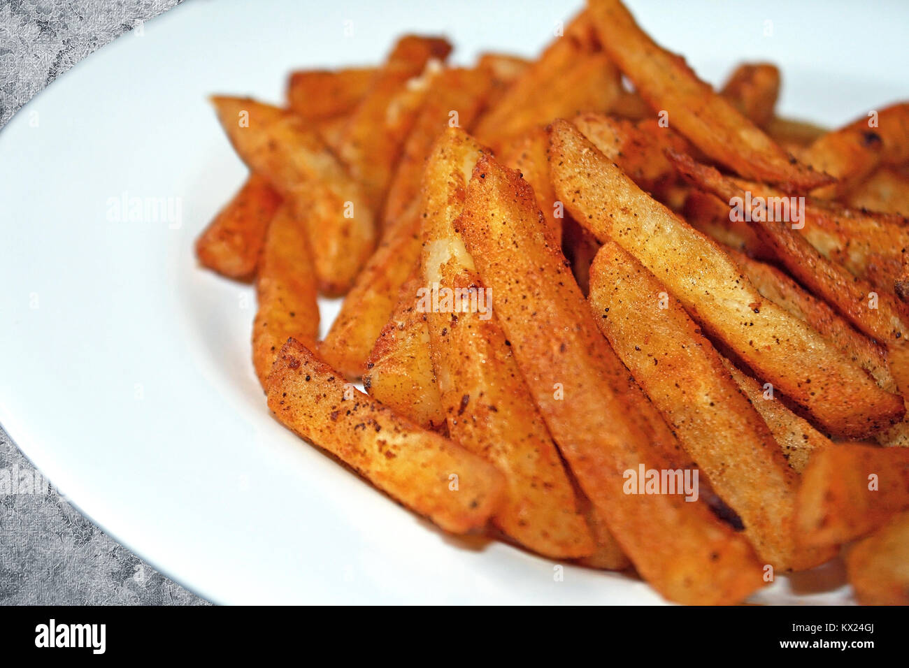 Ofen gebacken Pikant Pommes Frites Stockfoto