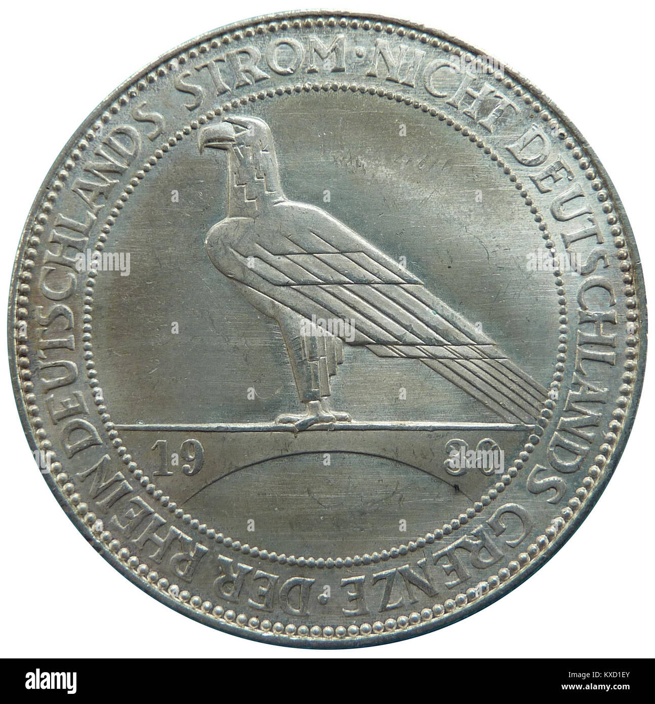 Das Foto zeigt eine Münze mit 5 Reichsmark, die an die Evakuierung der alliierten Streitkräfte aus dem Rheinland 1930 erinnert und das Ende der Besatzung nach dem Ersten Weltkrieg markiert. Stockfoto