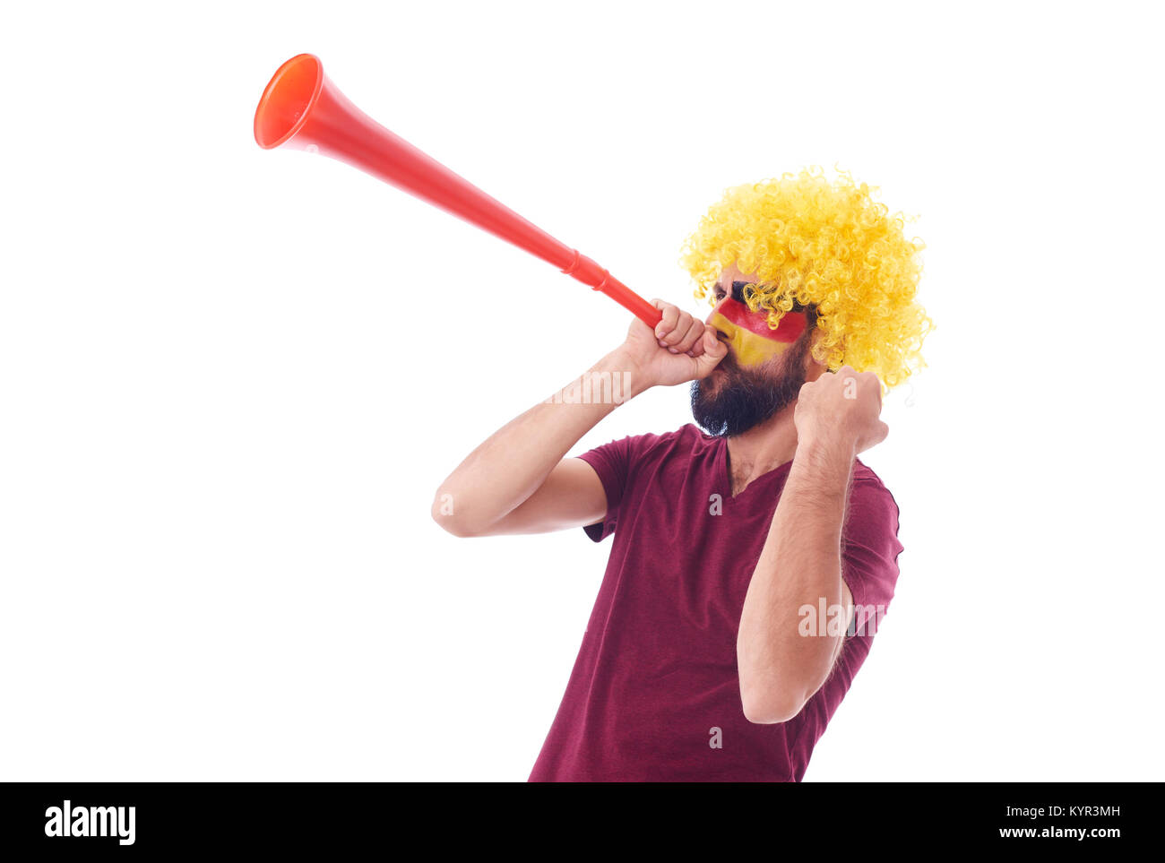 Fußball-Fan mit Perücke und die Vuvuzela feiern Stockfoto