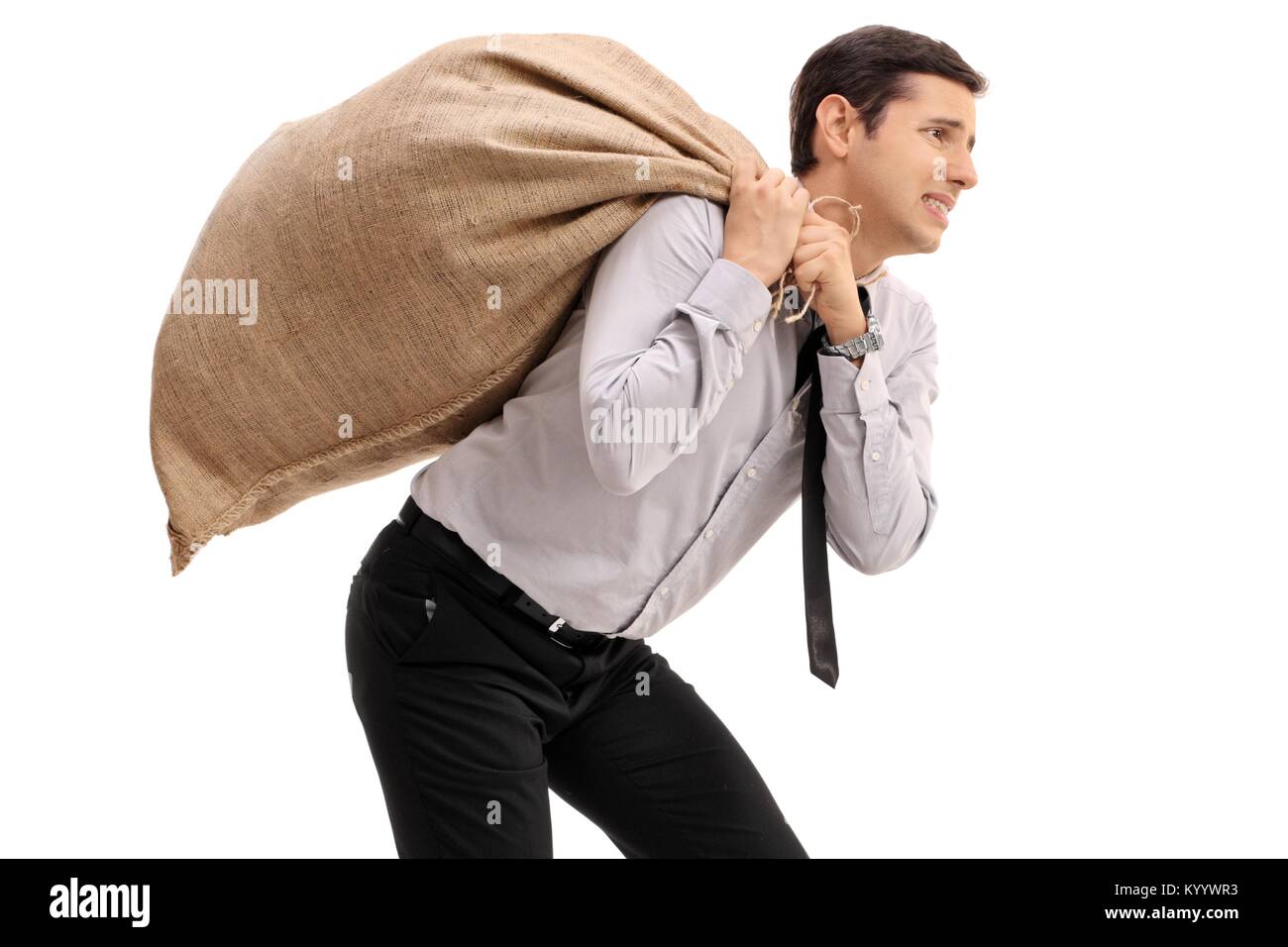 Geschäftsmann mit einem sackleinen Sack auf seinem Rücken isoliert auf weißem Hintergrund Stockfoto