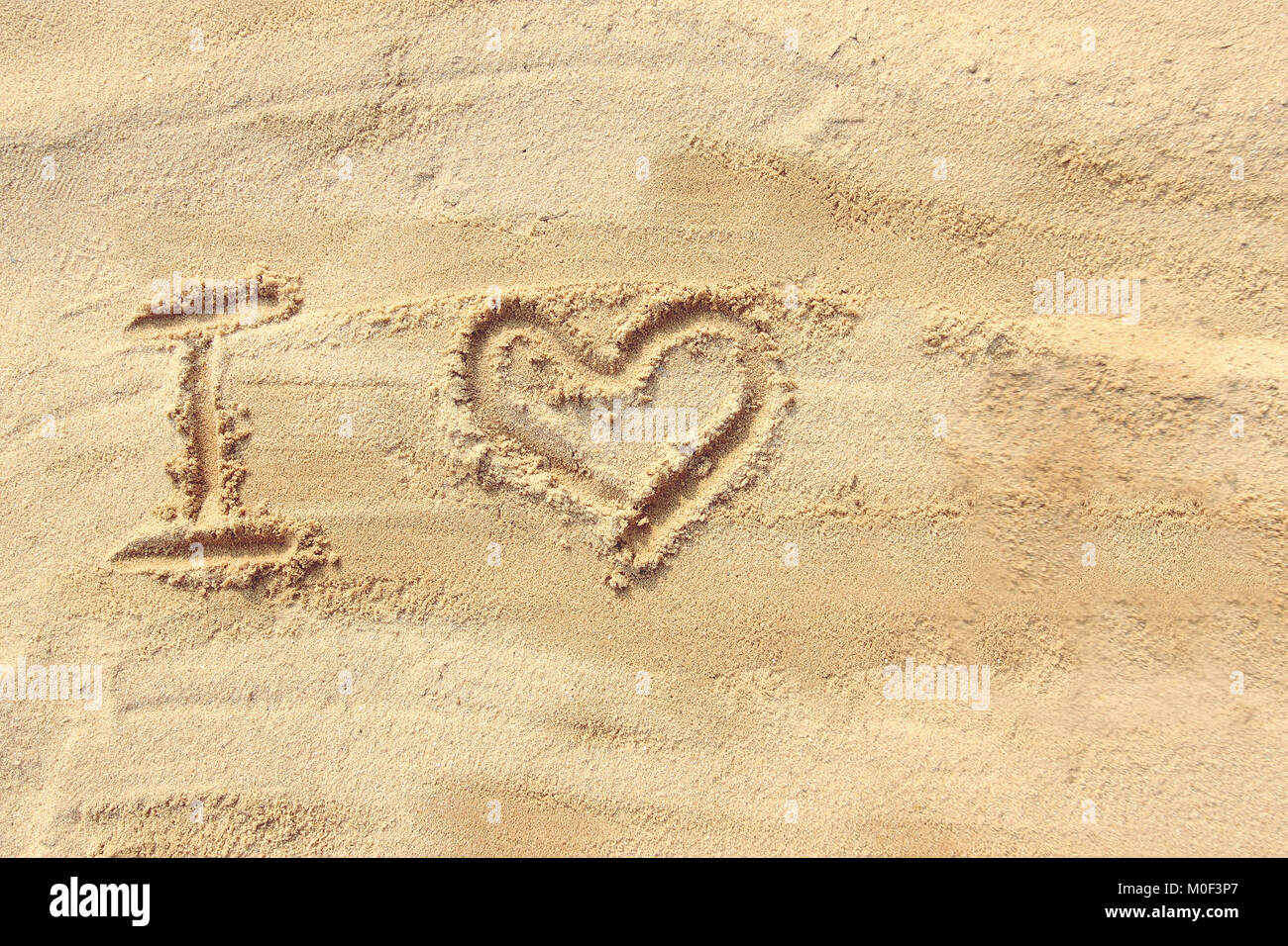 Ich liebe - Sand auf den Strand Stockfoto
