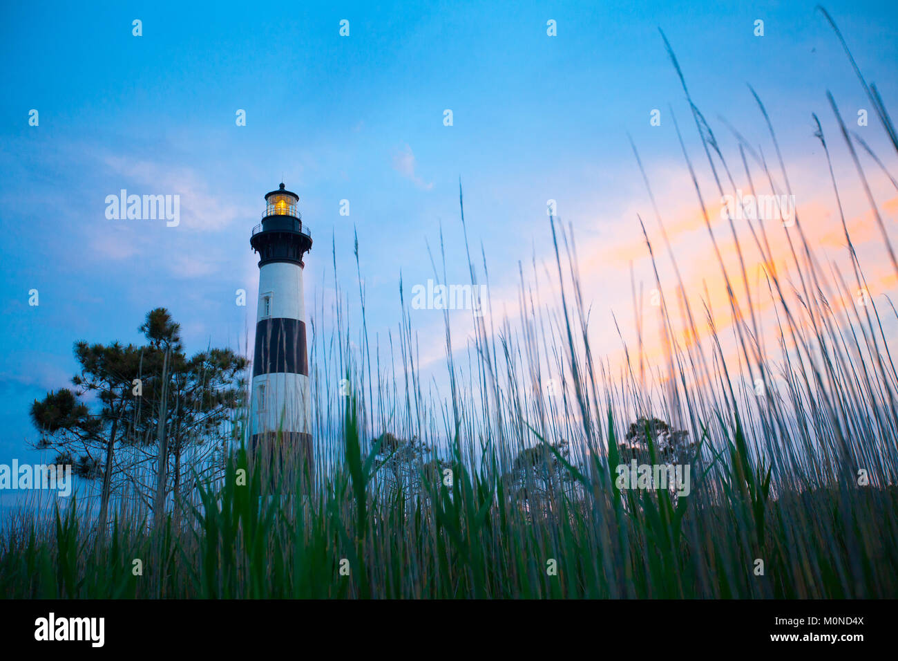 Körper Insel Leuchtturm bei Sonnenuntergang Stockfoto