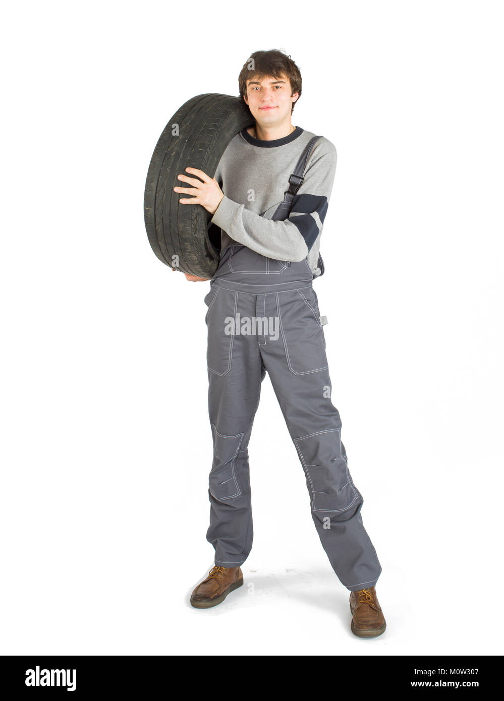 Eine junge brunet Vorarbeiter in die graue Uniform mit Schwarzes Rad. Stockfoto