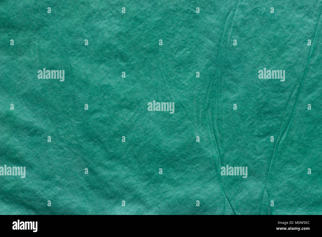 Grüne Farbe gefaltetes Seidenpapier bacground Textur Stockfoto