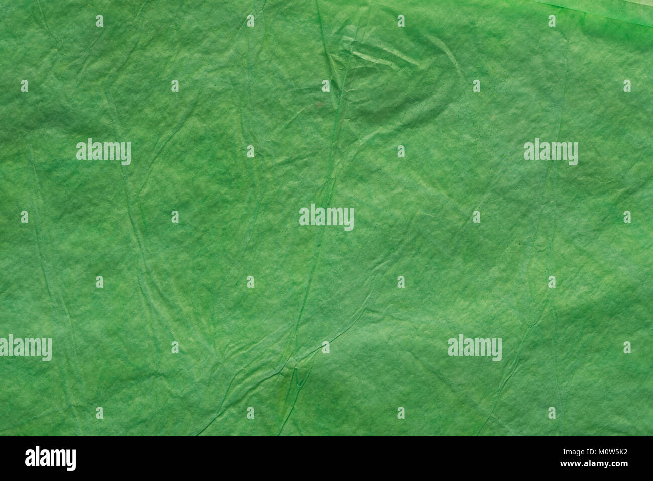 Grüne Farbe gefaltetes Seidenpapier bacground Textur Stockfoto