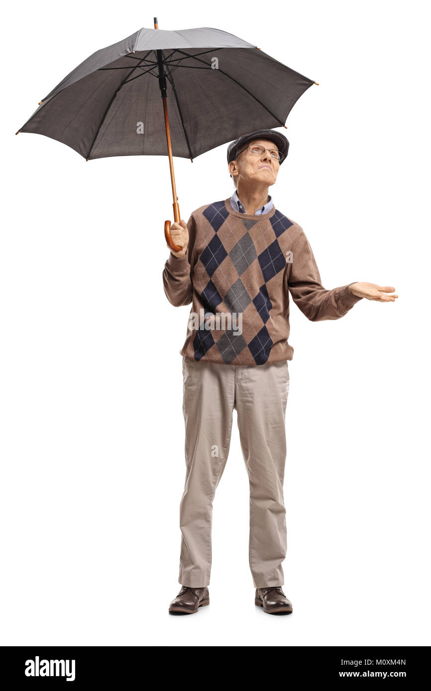 In voller Länge Porträt eines leitenden Holding einen Regenschirm und überprüfen, um zu sehen, wenn es regnet isoliert auf weißem Hintergrund Stockfoto