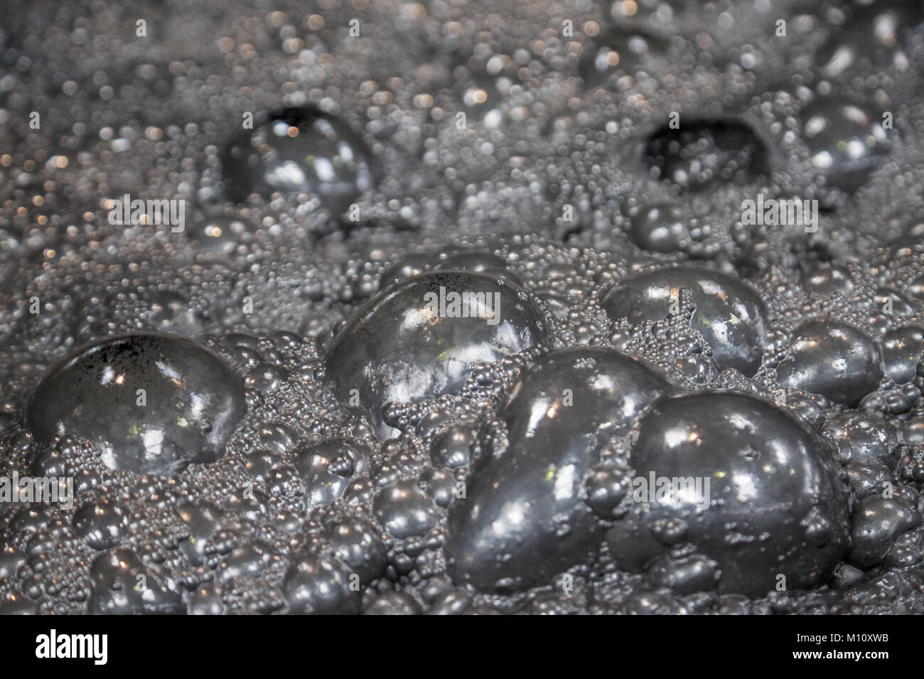 Goldene Erz Blasen Hintergrund Stockfoto