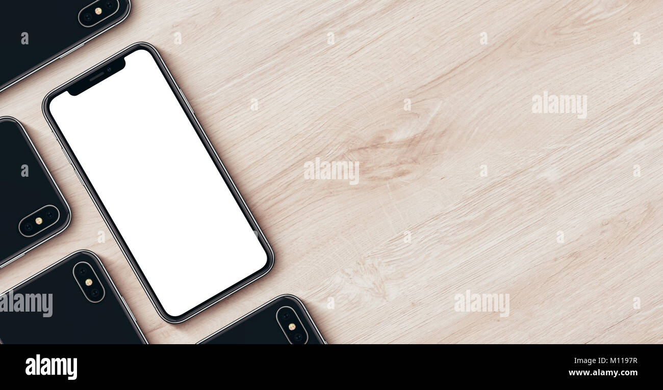 Smartphones wie iPhone X mockup Banner mit Copyspace flach Draufsicht liegen auf Holz- büro Schreibtisch. Stockfoto