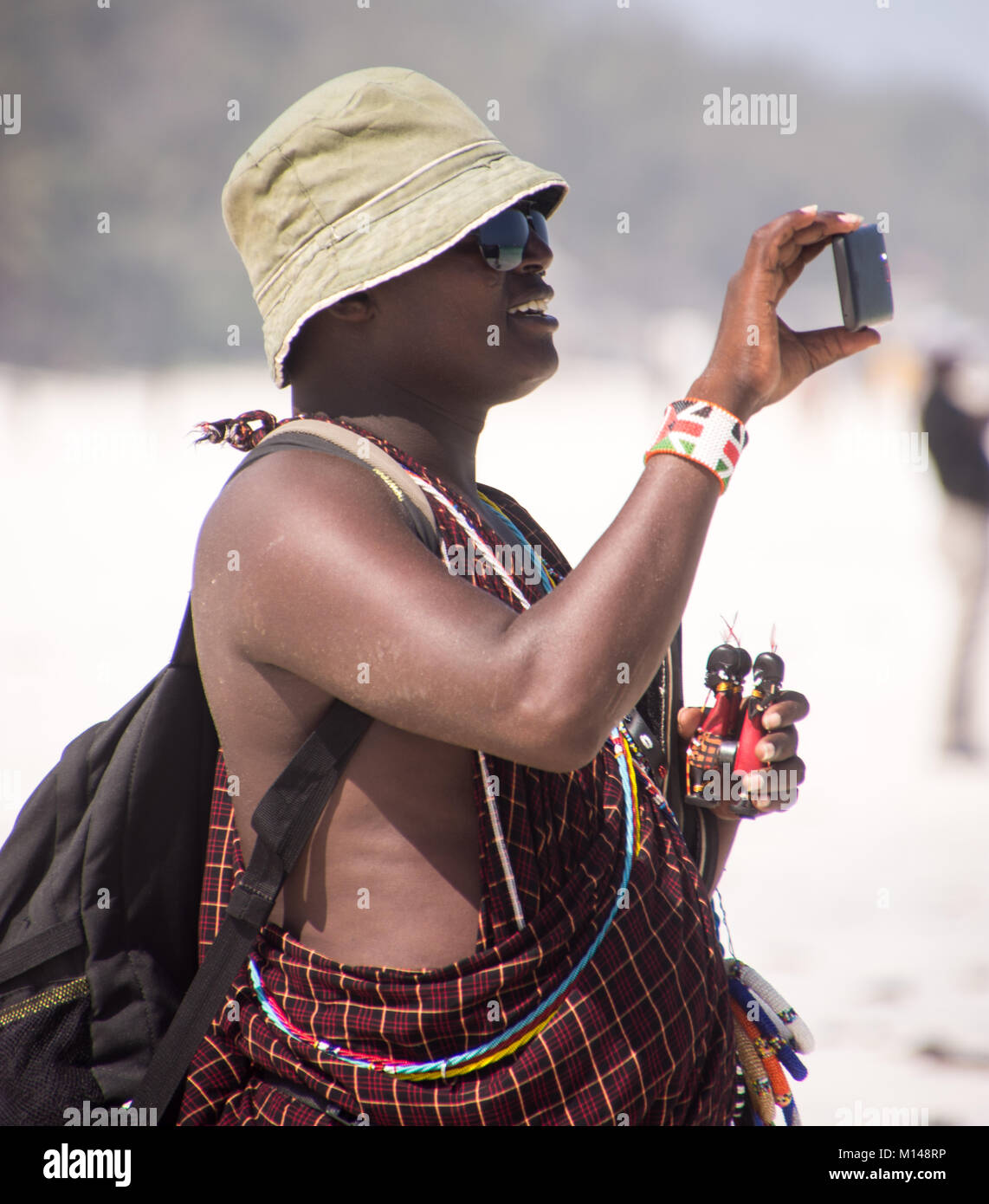 Masai Moran am Strand Stockfoto