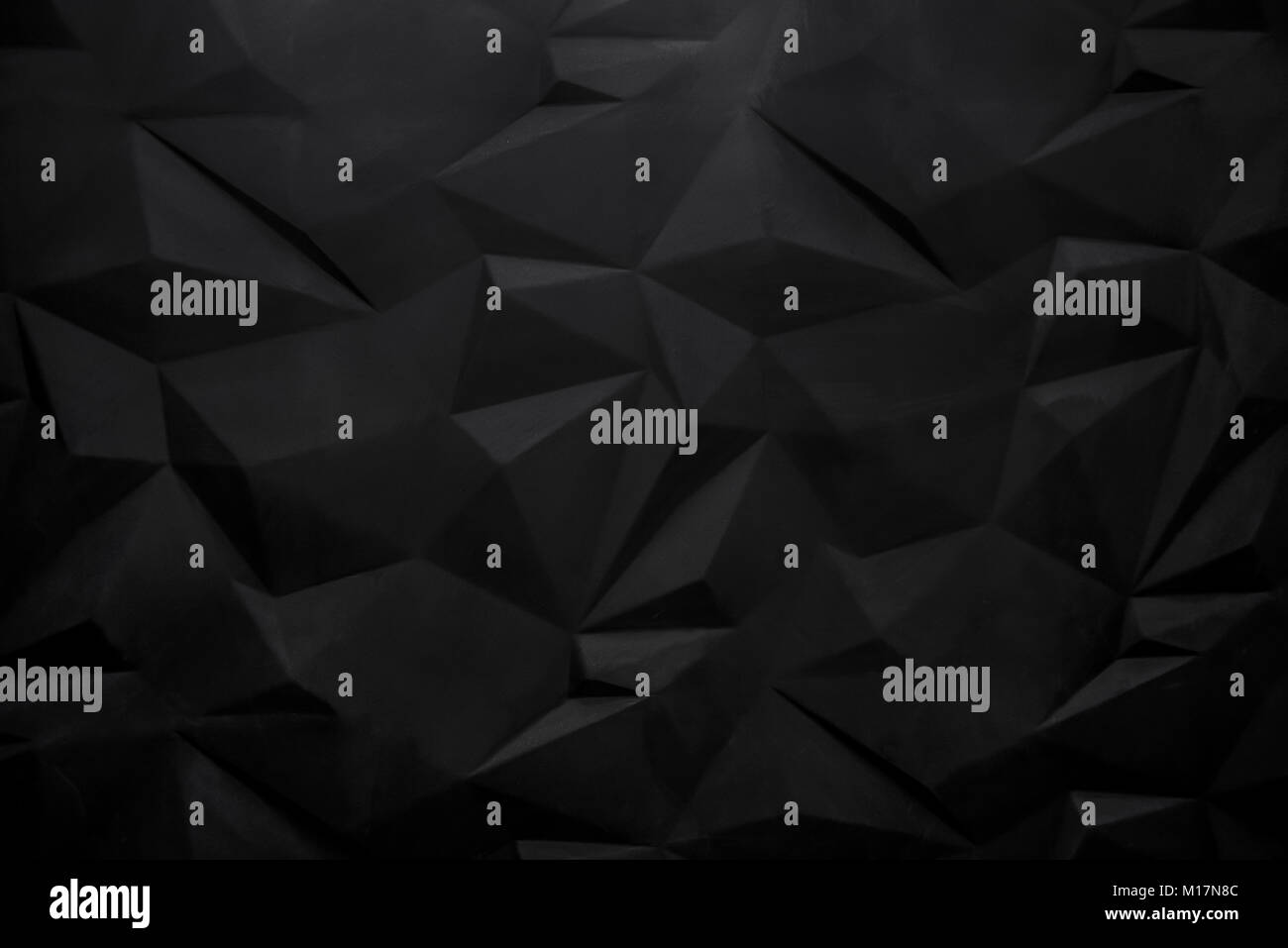 Schwarz abstrakte polygonalen Hintergrund Wand. Soft Focus. Stockfoto