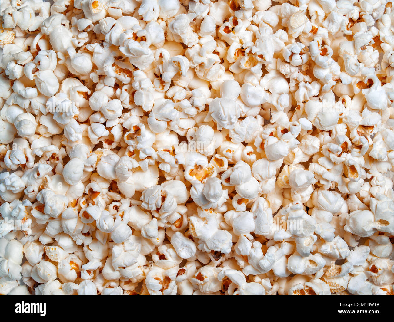 Bereit Popcorn Mais Getreide strukturelle Hintergrund close-up auf der Oberseite Stockfoto