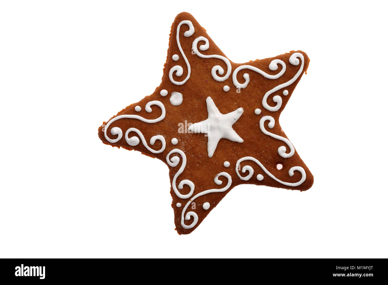 Ein Sternchen von süßen Lebkuchen verziert mit weißen Sahnehäubchen ist die beste Weihnachtsdekoration. Stockfoto