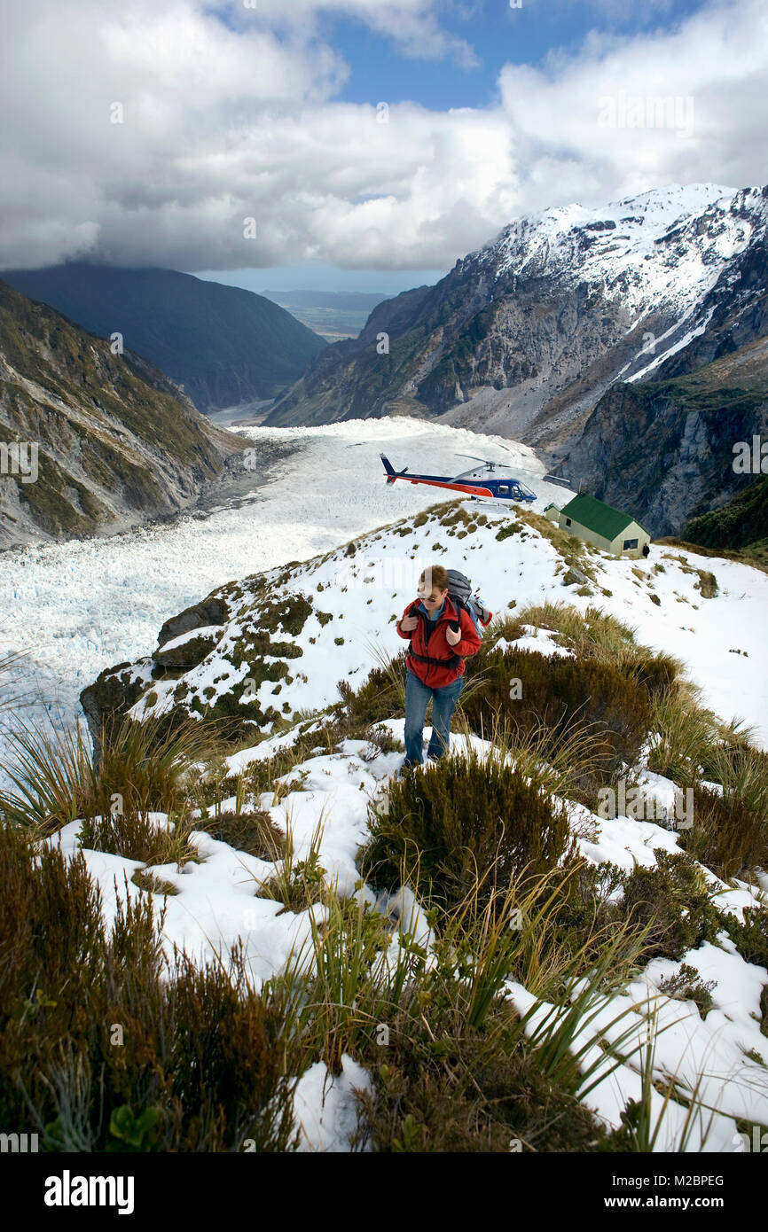Neuseeland, Südinsel, Fox Glacier, Touristische, Trekking nach per Hubschrauber bei Bundeskanzler Hütte gefallen wird. Unesco-Weltkulturerbe. Stockfoto