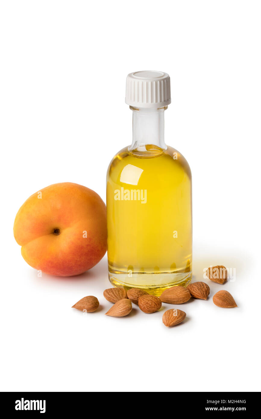 Glasflasche mit kosmetischen Aprikosenkernöl auf weißem Hintergrund Stockfoto