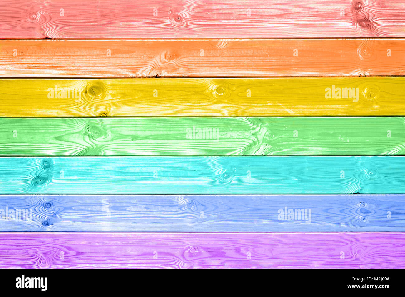 Pastellfarben bunten Regenbogen bemalt Holzplanken Hintergrund Stockfoto