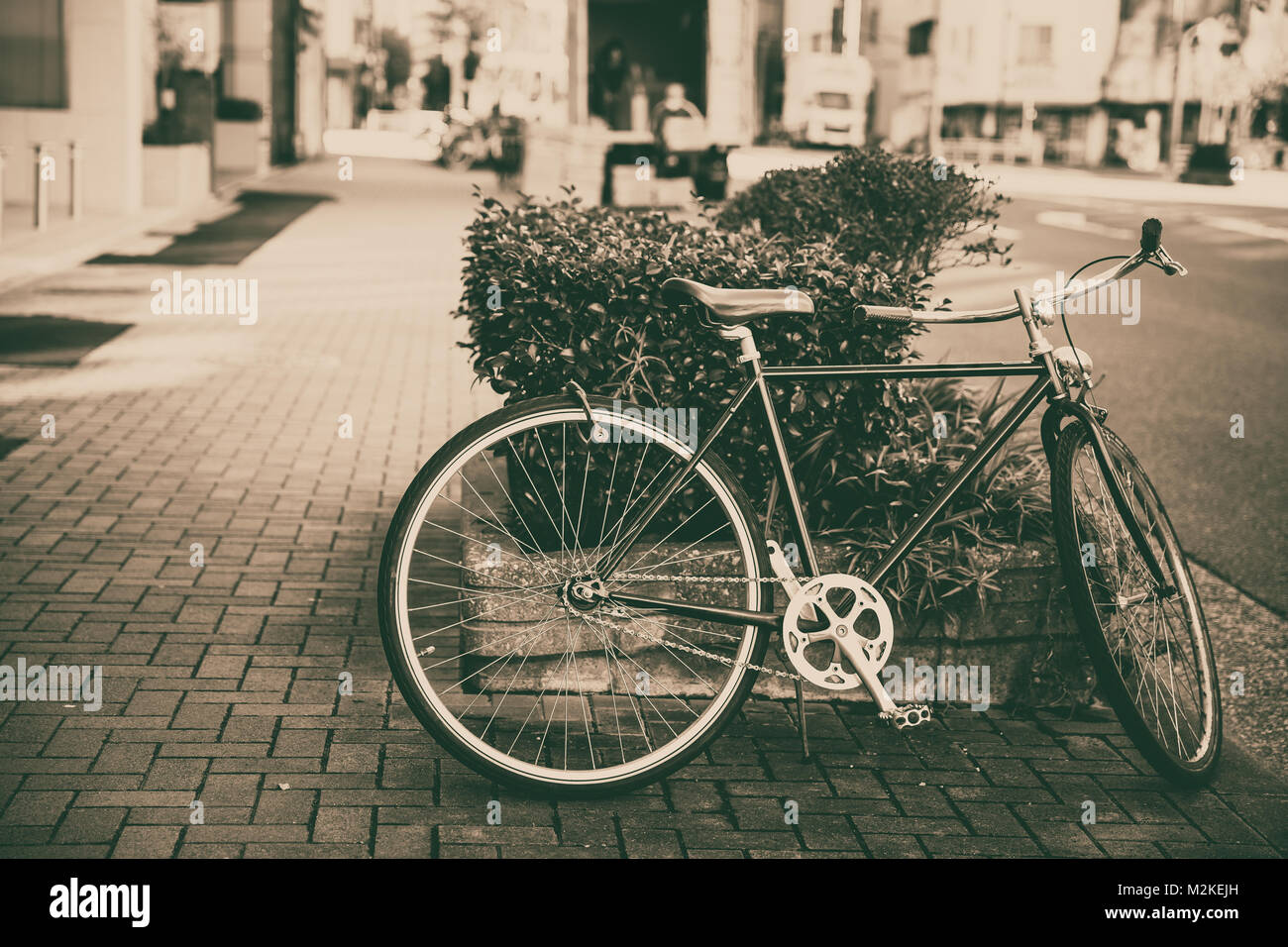 Fahrrad parken auf der Straße alte Vintage Retro Farbton Stockfoto