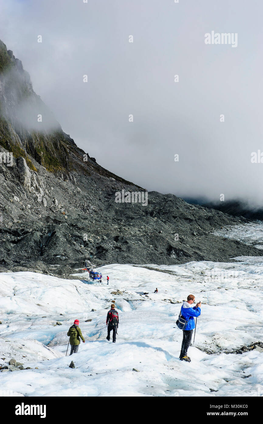 Touristische Wanderungen auf Fox Glacier, South Island, Neuseeland Stockfoto