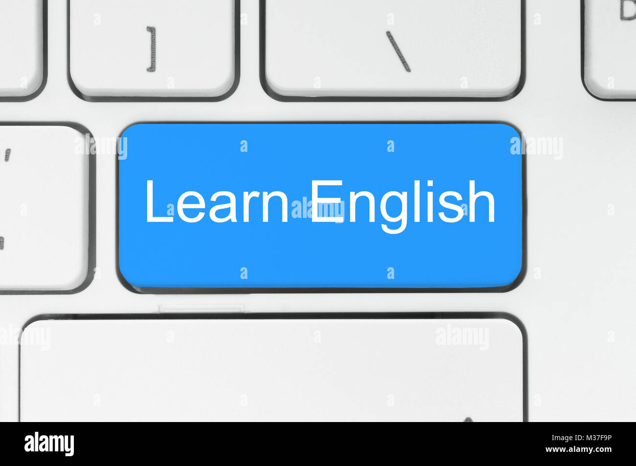Blaue Schaltfläche mit der englischen Wörter auf der Tastatur close-up Stockfoto