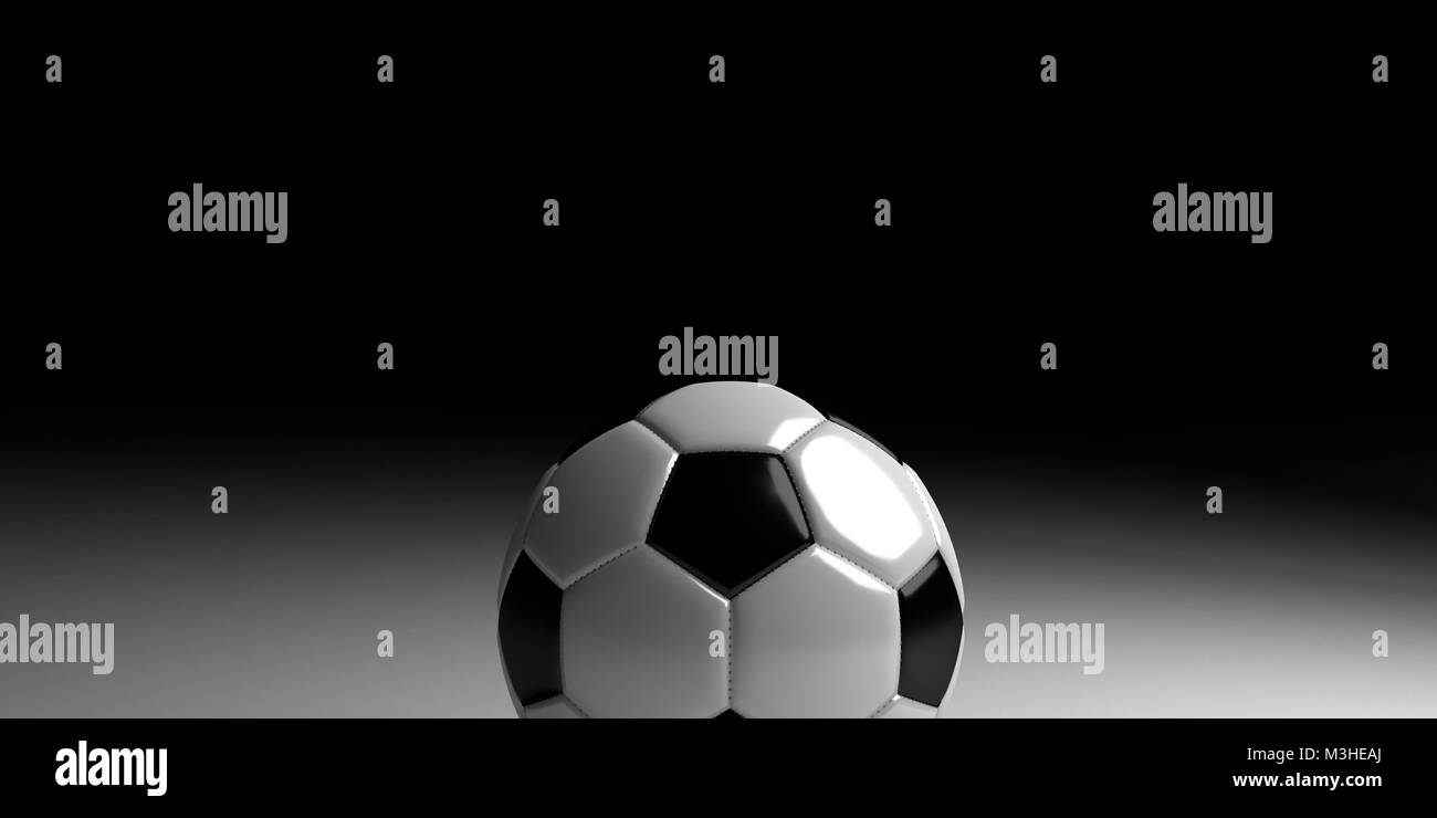 Fußball auf weisse Fläche mit einem schwarzen Hintergrund Stockfoto