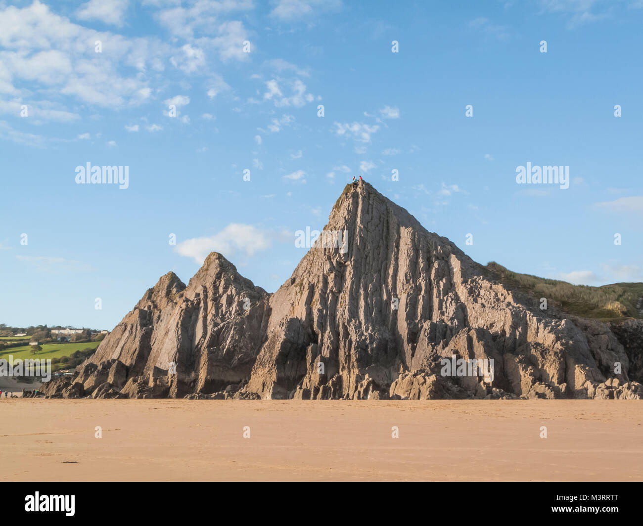 Klettern auf den drei Klippen an drei Cliff Bay, South Wales Stockfoto