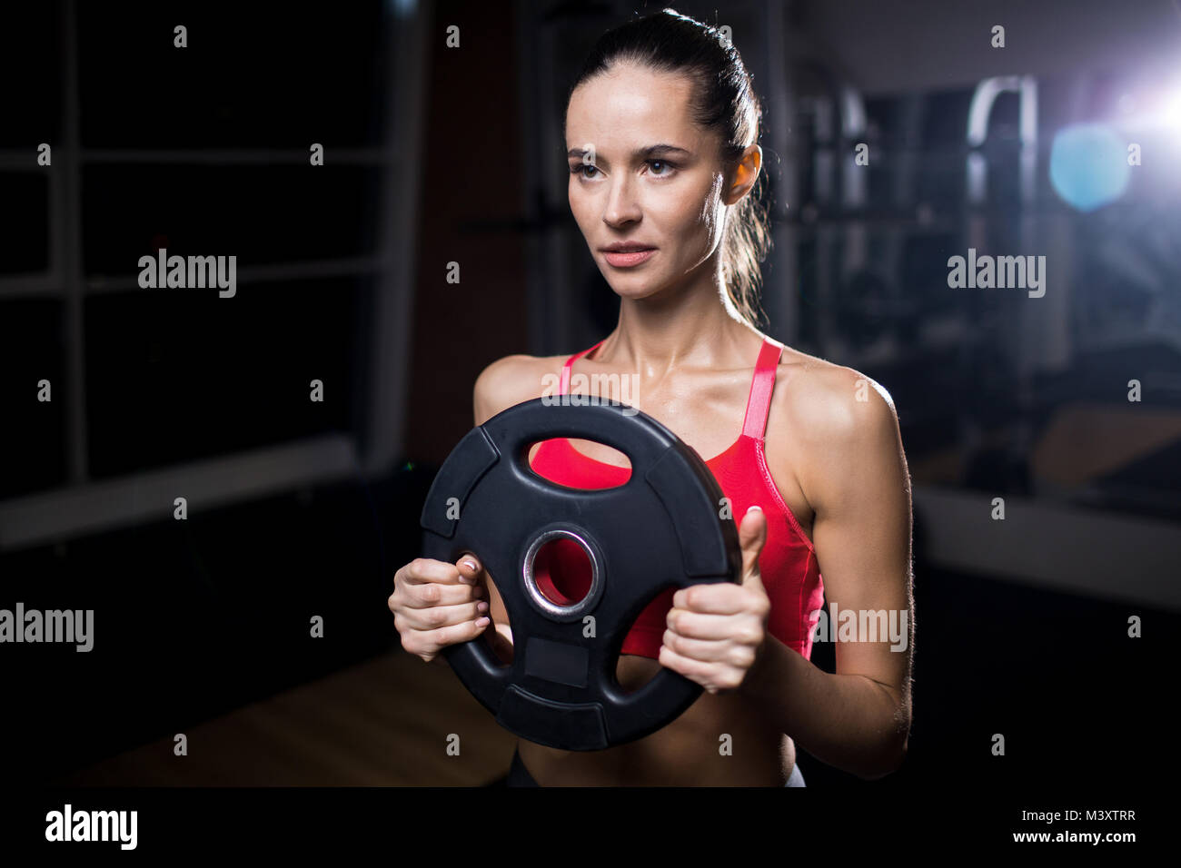 Mädchen mit langhantel Disc Stockfoto