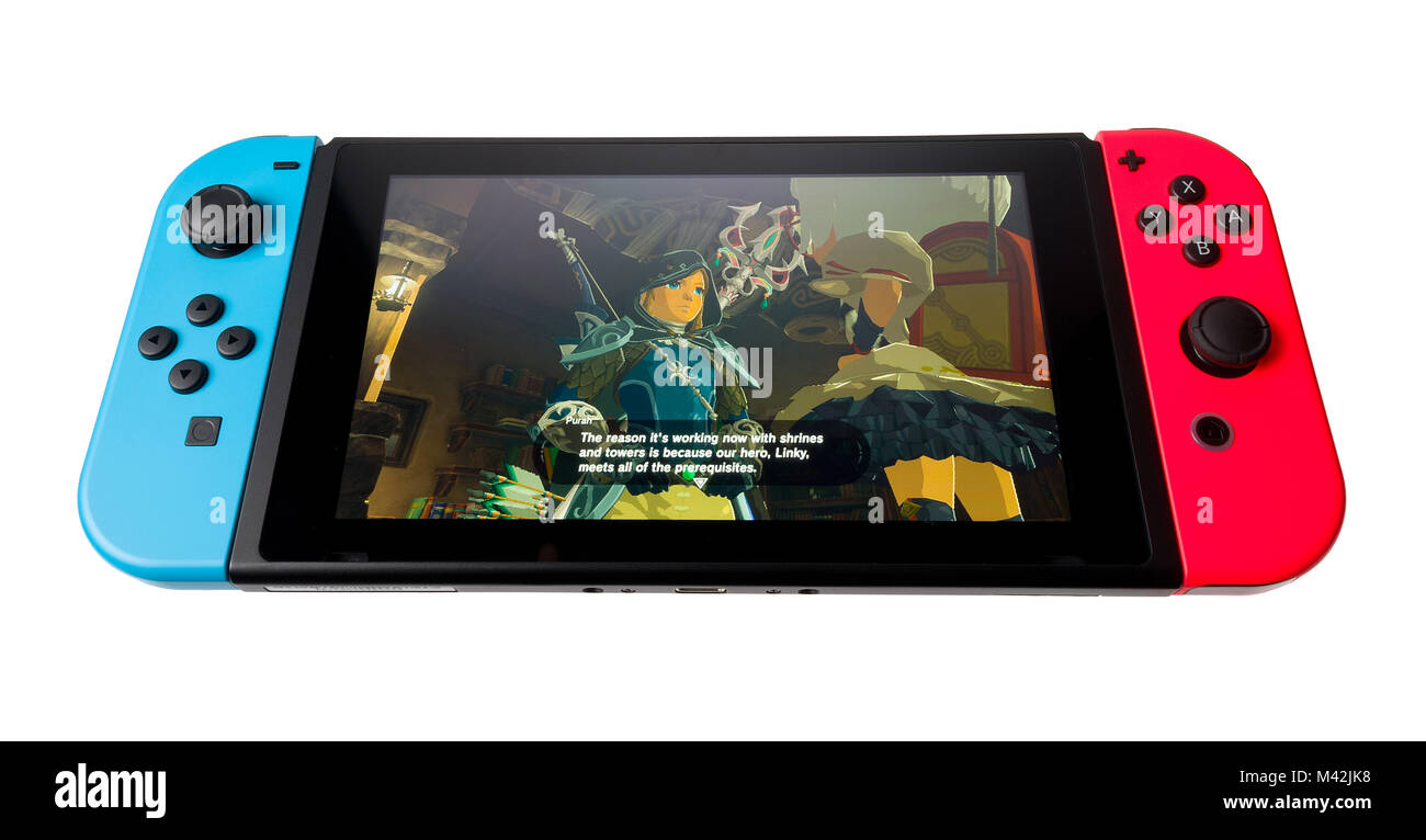 Nintendo Schalter mit Neon-rot und Neon Blue Freude-con Controller. Stockfoto