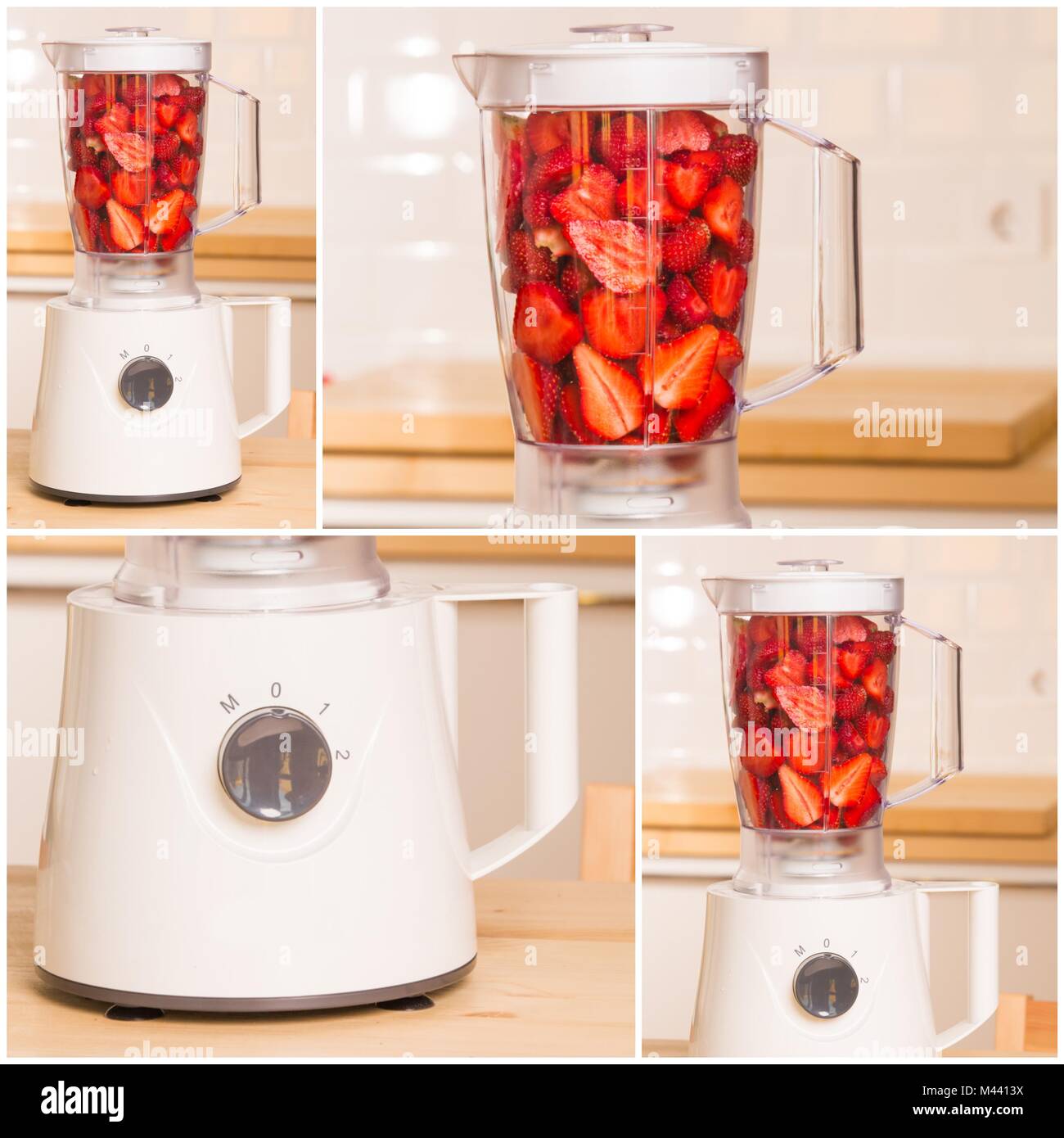 Frische Erdbeeren in weißer Blender auf einem Holztisch Stockfoto