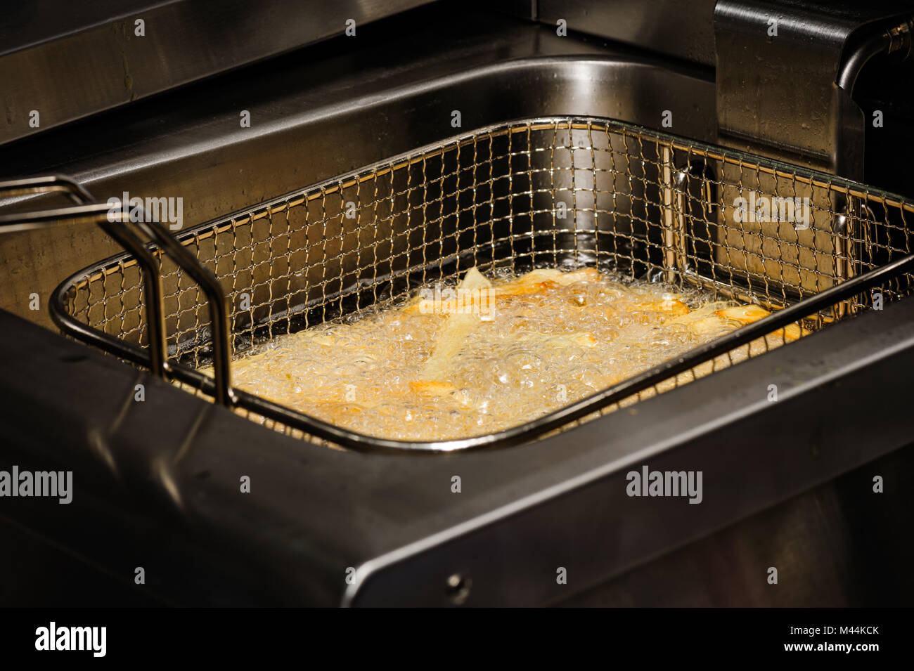 Zubereitung von Pommes frites Stockfoto