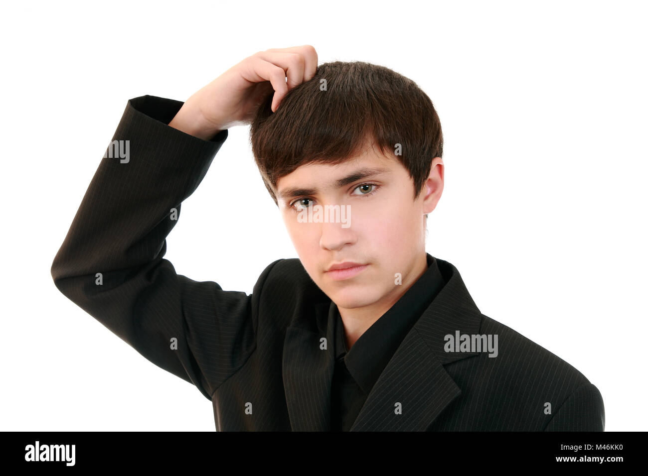 Ein Gut Aussehender Teenager In Einem Anzug Nachdenklich Den Kopf Kratzen Geste Der Meditation Neue Ideen Erfindungen Stockfotografie Alamy