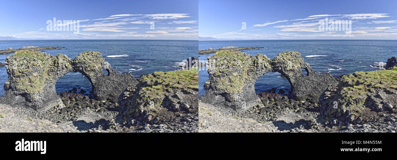 Küste und Klippen von Basaltgestein bei Arnarstapi Naturschutzgebiet durch Loch im Felsen gesehen. Snaefellsness Halbinsel, Island Stockfoto