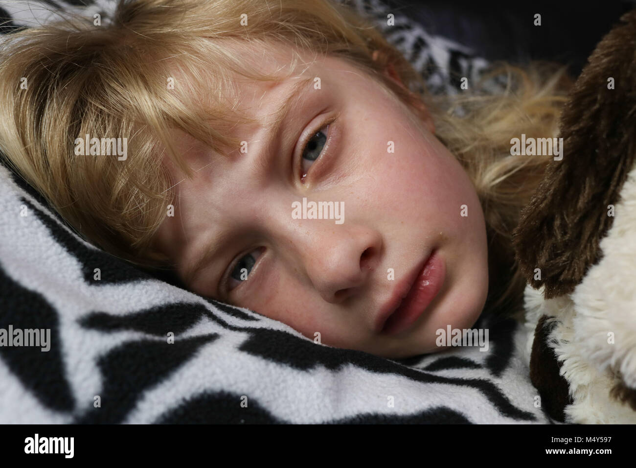 Porträt eines Kindes mit der Grippe Stockfoto