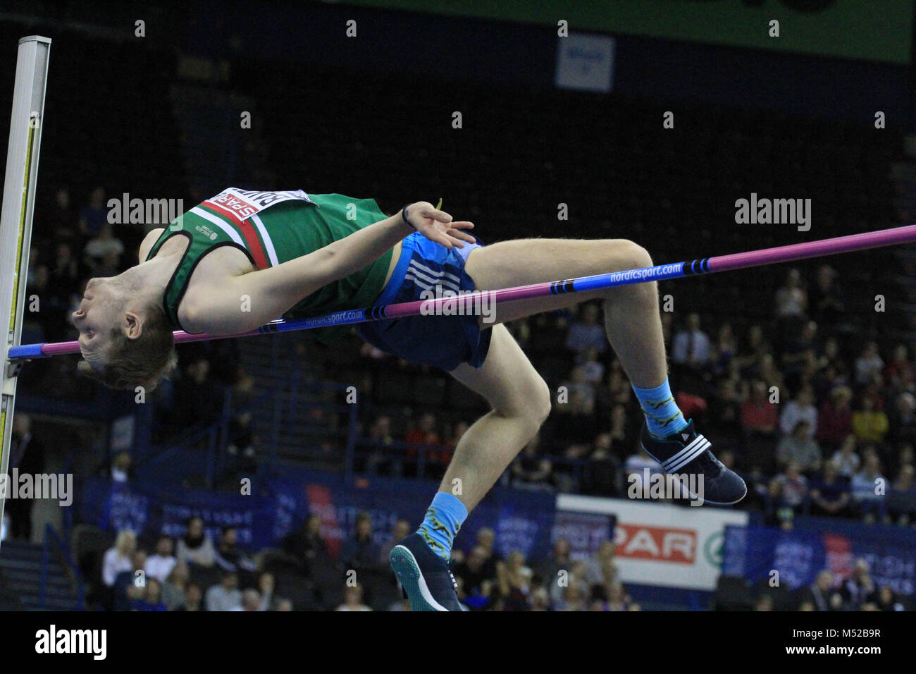Chris Baker konkurriert, während die hohe Männer springen am britischen Indoor Championships in Birmingham. Stockfoto