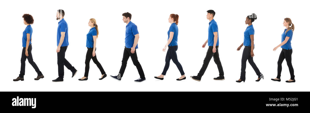 Gruppe von Hausmeister zu Fuß in einer Reihe über weißen Hintergrund Stockfoto