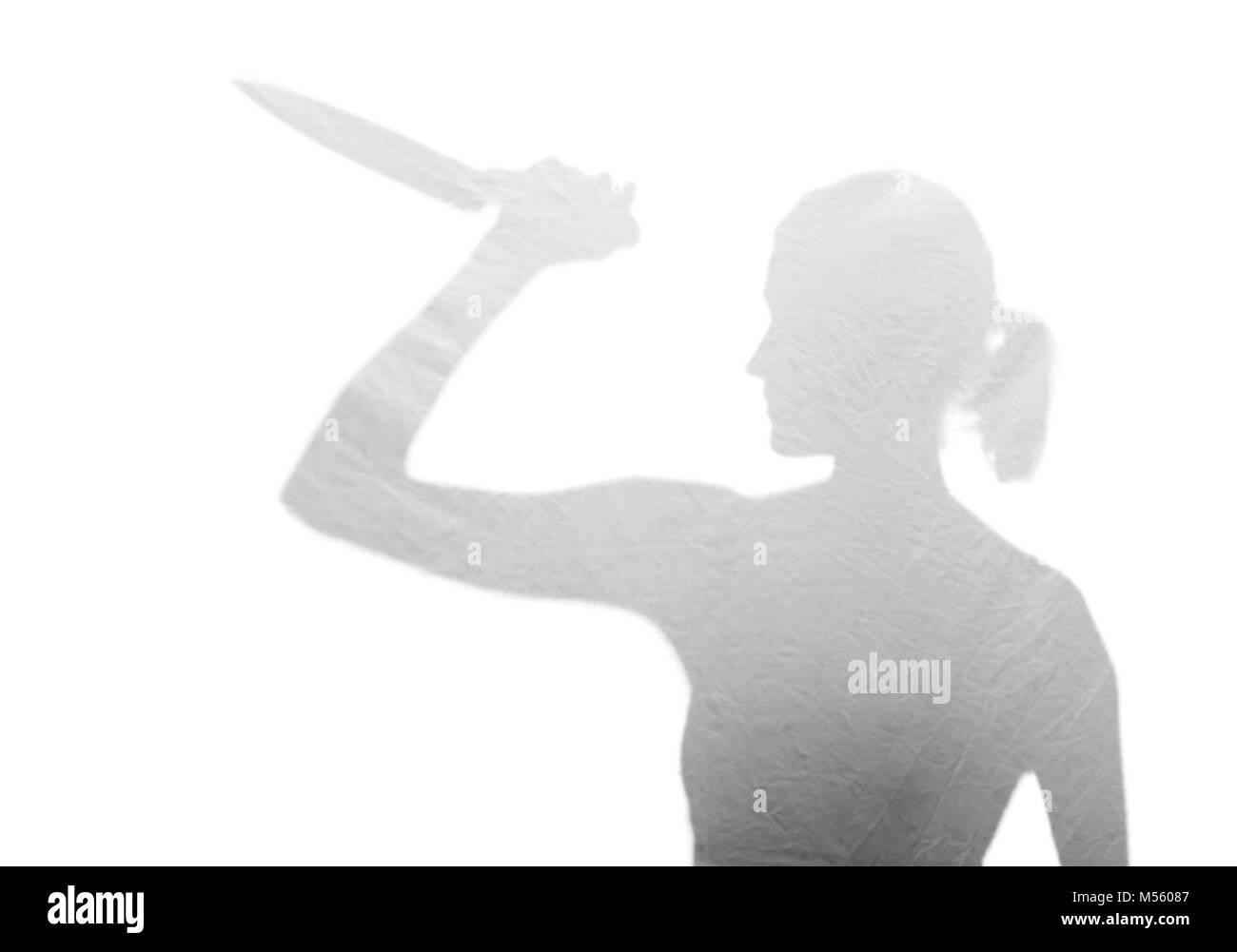 Frau mit Messer Stockfoto